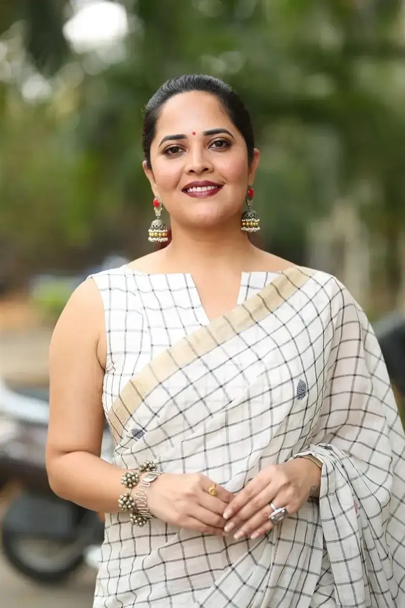 Anasuya Bharadwaj in White Saree at Razakar Movie Launch